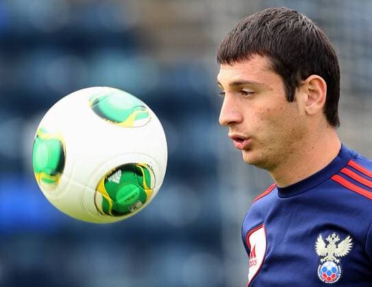 ITAR-TASS: BELFAST, UK. AUGUST 13, 2013. Russia s Alan Dzagoev at a training session of the Russian national football team for the 2014 FIFA World Cup qualifying match against Northern Ireland, at Windsor Park Stadium.  premiumd RE125399