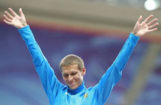 ITAR-TASS: MOSCOW, RUSSIA. AUGUST 15, 2013. Silver medal winner, Russia s Mikhail Ryzhov during the medal ceremony for the men s 50km walk at Luzhniki on Day 6 of the 14th IAAF World Championships in Athletics.  premiumd RE12573C