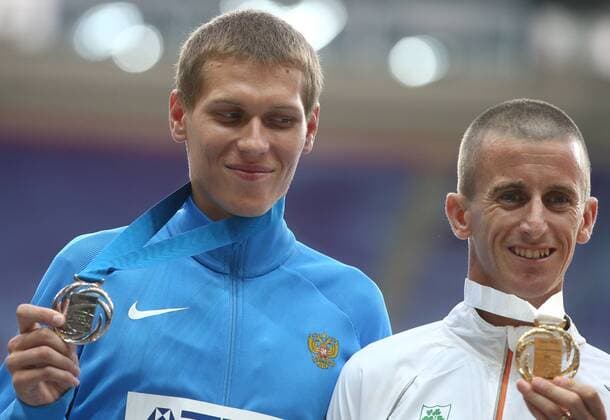 ITAR-TASS: MOSCOW, RUSSIA. AUGUST 15, 2013. Silver medal winner, Russia s Mikhail Ryzhov (L), and gold medal winner, Ireland s Robert Heffernan during the medal ceremony for the men s 50km walk at Luzhniki on Day 6 of the 14th IAAF World Championships in Athletics.  premiumd RE12573D
