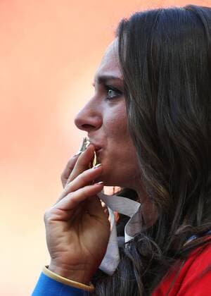ITAR-TASS: MOSCOW, RUSSIA. AUGUST 15, 2013. Gold medal winner, Russia s Yelena Isinbayeva kisses her medal during the medal ceremony for the women s pole vault final at Luzhniki on Day 6 of the 14th IAAF World Championships in Athletics.  premiumd RE12570F