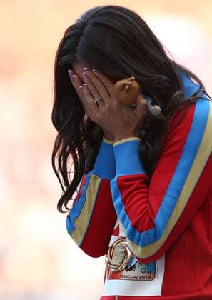 ITAR-TASS: MOSCOW, RUSSIA. AUGUST 15, 2013. Gold medal winner, Russia s Yelena Isinbayeva reacts during the medal ceremony for the women s pole vault final at Luzhniki on Day 6 of the 14th IAAF World Championships in Athletics.  premiumd RE125713
