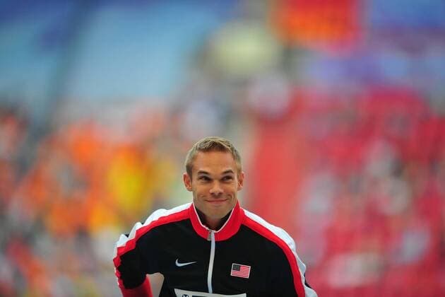MOSCOW, Aug. 15, 2013 - Silver medallist Nick Symmonds of the United States poses during the victory ceremony for the men s 800 metres at the IAAF World Athletics Championships at the Luzhniki stadium in Moscow Aug. 15, 2013. Nick Symmonds took the silver with 1:43.55. (Xinhua Dai Tianfang) (SP)RUSSIA-MOSCOW-ATHLETICS-IAAF WORLD CHAMPIONSHIPS 
