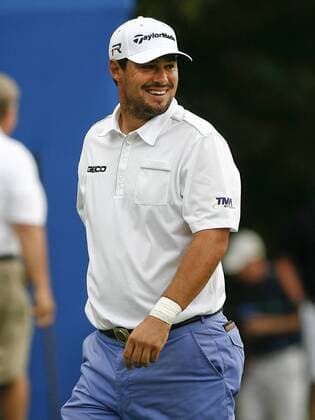 Aug. 16, 2013 - Greensboro, North Carolina, U.S - JOHNSON WAGNER smiles as he leaves the course during the second round of the 2013 Wyndham Championship at Sedgefield Country Club. Golf 2013 - Wyndham Championship  - ZUMAh10