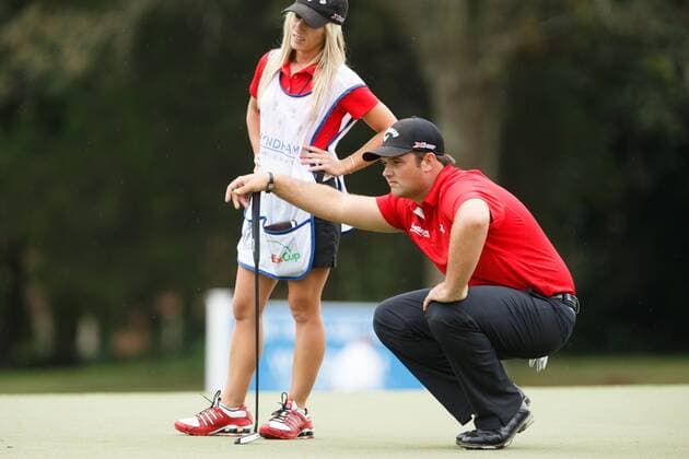 16 August 2013: Patrick Reed lines up his putt for birdie with his caddy wife Justine Reed during the second round of the Wyndham Championship at Sedgefield Country Club in Greensboro, NC. GOLF: AUG 16 PGA Golf Herren - Wyndham Championship - Round 2 Icon130816009 EDITORIAL USE ONLY