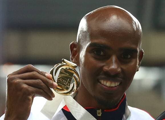 ITAR-TASS: MOSCOW, RUSSIA. AUGUST 16, 2013. Gold medallist, Britain s Mohamed Farah during the medal ceremony for the men s 5000m final at Luzhniki on Day 7 of the 14th IAAF World Championships in Athletics.  RE125974