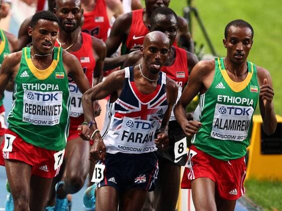 ITAR-TASS: MOSCOW, RUSSIA. AUGUST 16, 2013. Ethiopia s Hagos Gebrhiwet, Britain s Mohamed Farah, and Ethiopia s Yenew Alamirew (L-R front) compete in the men s 5000m final at Luzhniki on Day 7 of the 14th IAAF World Championships in Athletics.  RE125947