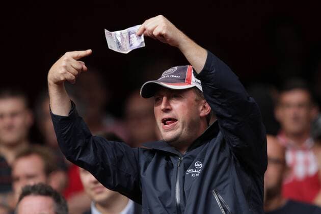 Arsenal FC . . London, UK . . 17.08.2013 An Arsenal fan urges Arsenal and Arsene Wenger to spend some money on new players. 