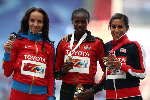 ITAR-TASS: MOSCOW, RUSSIA. AUGUST 18, 2013. Russia s silver medalist Mariya Savinova, Kenia s gold medalisit Eunice Jepkoech Sum, and US Brenda Martinez (L-R) pose at the awarding ceremony for the women s 800m event at the 2013 IAAF World Championships in Athletics, at Luzhniki Stadium.  premiumd RE125C35