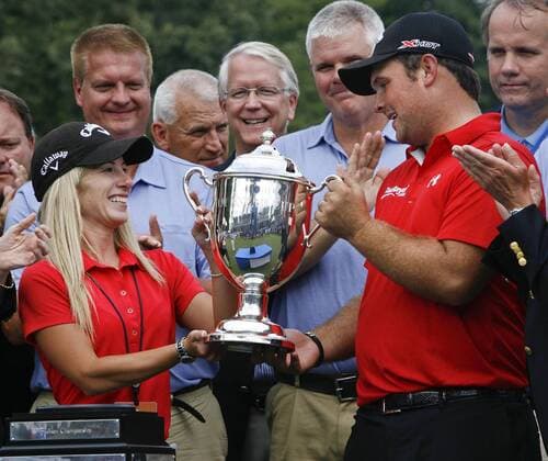 Aug. 18, 2013 - Greensboro, North Carolina, U.S - PATRICK REED and his wife JUSTINE REED are presented the trophy after winning the 2013 Wyndham Championship at Sedgefield Country Club. Golf 2013 - Wyndham Championship  - ZUMAh10