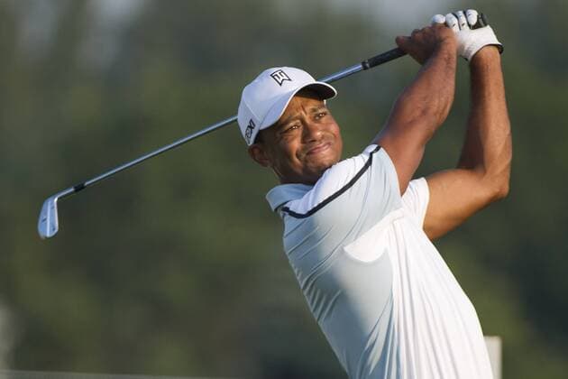 Aug. 21, 2013 - Jersey City, New Jersey, U.S - August 21, 2013: Tiger Woods (USA) hits off a tee in the early morning light during The Barclays Fed Ex Pro-Am at Liberty National Golf Course in Jersey City, NJ. Kostas Lymperopoulos csm GOLF 2013: The Barclays Fed Ex Championship AUG 21 - ZUMAc04