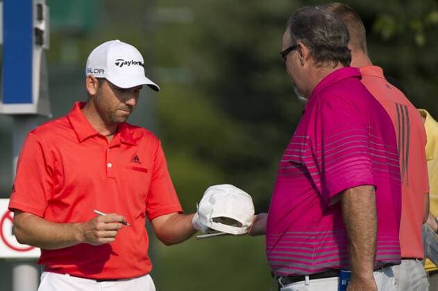 Aug. 21, 2013 - Jersey City, New Jersey, U.S - August 21, 2013: Sergio Garcia (ESP) signs a hat for a fan during The Barclays Fed Ex Pro-Am at Liberty National Golf Course in Jersey City, NJ. Kostas Lymperopoulos csm GOLF 2013: The Barclays Fed Ex Championship AUG 21 - ZUMAc04