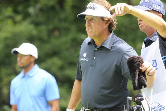 Aug. 30, 2013 - Norton, Massachusetts, USA - August 30, 2013 - Norton, Massachusetts, U.S. - Phil Mickelson discusses his shot from the 9th tee with his caddy during the first round of the Deutsche Bank Championship, FedEx Cup playoffs held at the Tournament Players Club in Norton Massachusetts. Mickelson finished the day 8 under with a 63. Eric Canha CSM PGA Golf Herren 2013: Deutsche Bank Championship Round 1 AUG 30 - ZUMAc04