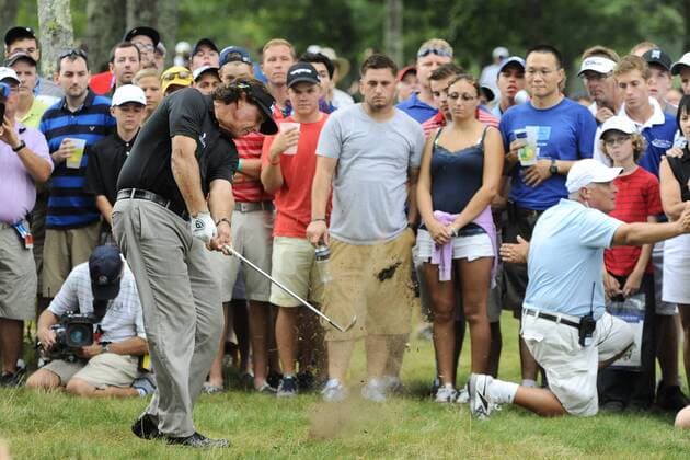 Aug. 31, 2013 - Norton, Massachusetts, USA - August 31, 2013 - Norton, Massachusetts, U.S. - Phil Mickelson shoots his way back onto the 13th fairway after having landed a shot well outside the ropes during the second round of the Deutsche Bank Championship, FedEx Cup playoffs held at the Tournament Players Club in Norton Massachusetts. Eric Canha CSM PGA Golf Herren 2013: Deutsche Bank Championship Round 2 AUG 31 - ZUMAc04