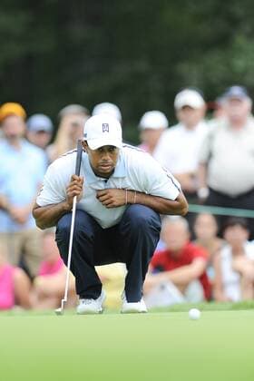 Aug. 31, 2013 - Norton, Massachusetts, USA - August 31, 2013 - Norton, Massachusetts, U.S. - Tiger Woods reads a putt on the 13th hole during the second round of the Deutsche Bank Championship, FedEx Cup playoffs held at the Tournament Players Club in Norton Massachusetts. Eric Canha CSM PGA Golf Herren 2013: Deutsche Bank Championship Round 2 AUG 31 - ZUMAc04