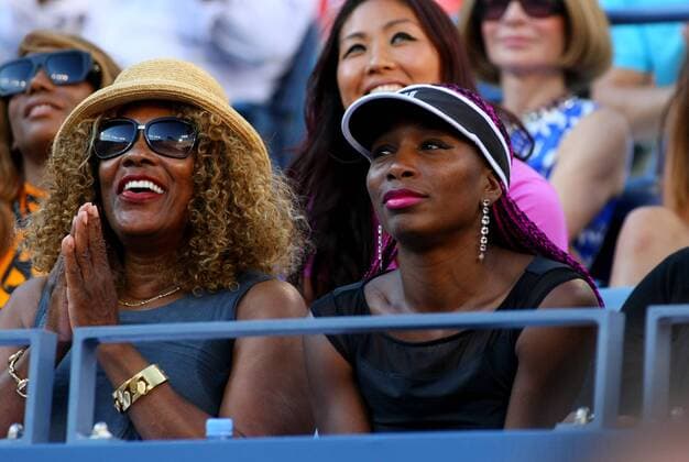 Venus Williams, (R), along with her mother mother Oracene Price, watches her sister Serena in the women s finals match at the U.S. Open Championship held at the USTA BillieJeanKing National Tennis Center on September 8, 2013 in New York City.  NYP20130908322