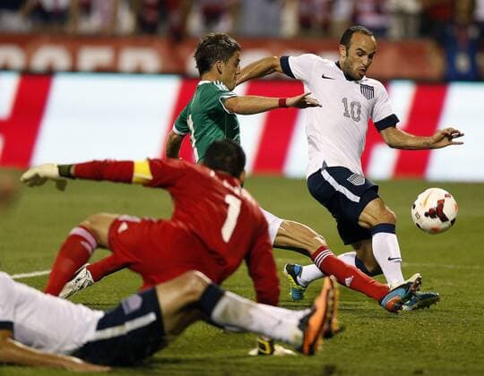 Sept. 10, 2013 - Columbus, Ohio, U.S. - LANDON DONOVAN (right) of the United States gets past Mexico defender HIRAM MIER (top center), setting up a score in the second half during 2014 FIFA World Cup Qualifying at Columbus Crew Stadium. The U.S. won, 2-0. Soccer 2013 - USA beats Mexico 2-0 - ZUMAm67