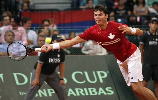 Milos Raonic of Canada returns a ball during their Davis Cup semifinal tennis match in Belgrade, Serbia, Sept. 13, 2013. (Xinhua BorislavxZdrinja) (SP)SERBIA-BELGRADE-TENNIS-DAVIS CUP 
