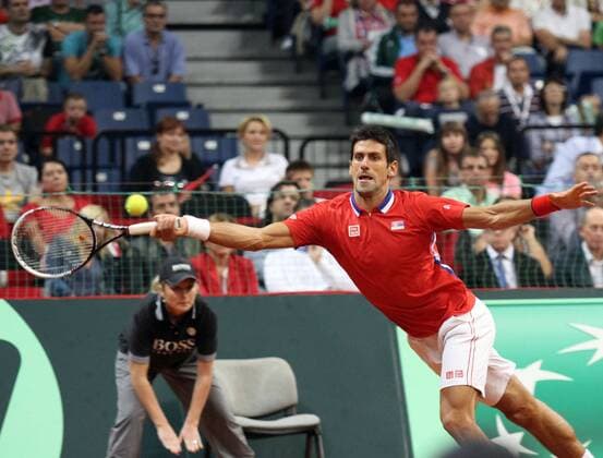 Serbia s Novak Djokovic returns a ball during the Davis Cup semifinals tennis match in Belgrade, Serbia, Sept. 15, 2013. (Xinhua BorislavZdrinja) (SP)SERBIA-BELGRADE-TENNIS-DAVIS CUP-SERBIA-CANADA 