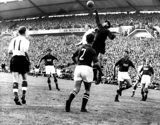 1958 World Cup England v Russia Russian goalkeeper Lev Yashin leaps to punch the ball away during the World Cup match in Gothenburg, Sweden. The match ended in 2-2 draw. 9th June 1958.  UnitedArchives00563206