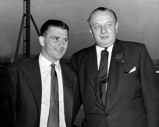 Ferenc Puskas, the Hungarian footballer, who, with others of his team, refused to re-enter Hungary following the revolution of 1956. He intends to retire and to coach eventually. Photo shows him with Barney Labany, assistant-catering manager of the large catering concern, Fortes. 12th March 1957  UnitedArchives00589139