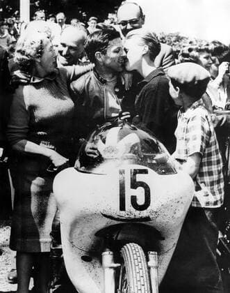 Phil Read : born 1 January 1939 , British Grand Prix motorcycle road racer . Seen here receiving a congratulatory kiss from his 16 year old girlfriend , Margaret Sheene , after he won the Junior TT race in the 350cc class , at Douglas , Isle of Man , United Kingdom . Phil Read , 22 , rode his Norton into first place in his first ever TT race , ahead of Gary Hocking , Southern Rhodesia and Derek Minter . 15 June 1961 UnitedArchives00695191