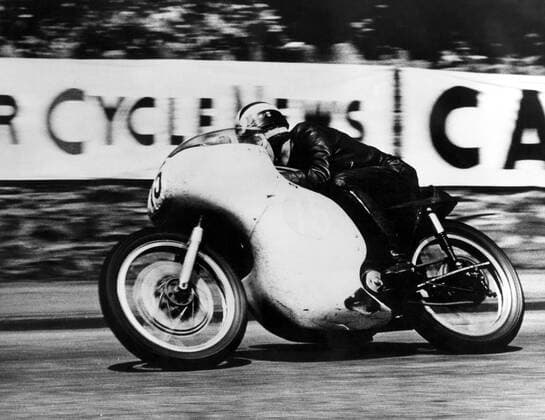 Phil Read : born 1 January 1939 , British Grand Prix motorcycle road racer . Seen here winning the Junior TT race in the 350cc class , at Douglas , Isle of Man , United Kingdom . Phil Read , 22 , rode his Norton into first place in his first ever TT race , ahead of Gary Hocking , Southern Rhodesia and Derek Minter . 15 June 1961  UnitedArchives00695192