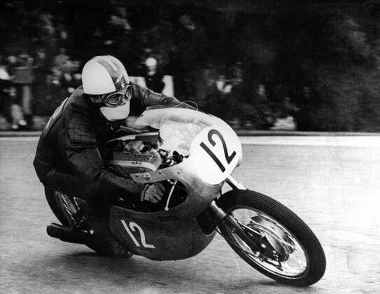 Japanese machines enjoyed a great sucess in the two lightweight solo events during the frist day of the Tourist Trophy Race at Douglas, Isle of Man,. Honda machines took the first three placings in both the 125 and 250 cc race. Mike Hailwood won both events. Picture shows: Japanese rider N. Taniguchi, riding a Japanese Honda during the TT in the Isle of Man 13th June 1961  UnitedArchives00834384