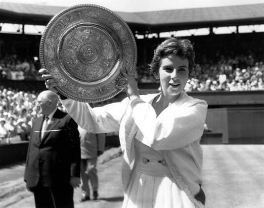 Maria Bueno of Brazil with the trophy after winning the Ladies Singles Title of the All England Lawn Tennis Championships at Wimbledon July 1959 Â  UnitedArchives00929330