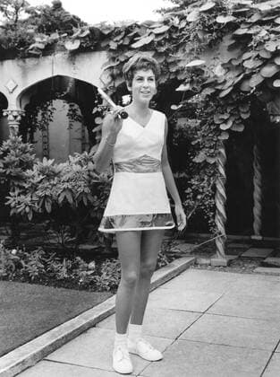Brazilian tennis star Maria Bueno wandering through the roof garden of a Kensington, London store, wearing Teddy Tinling s flared skimmer in Dacron and cotton with her midriff and hem in clear PVC - 17th June 1966 Â  UnitedArchives00930607
