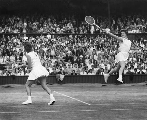 A flying return shot by Miss Margaret Smith partneed by Miss L. R. Turner. They beat their opponents in the final on 4th July 1964. Â  UnitedArchives00930609