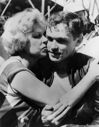 Rhodesia s Gary Hocking gets a victory hug in the paddock after winning the Senior TT event on the Isle of Man on a 500cc MV Agusta with a record speed of 103.51 mph. 8th June 1962  UnitedArchives00933788