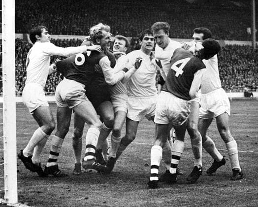 1968 League Cup Final Leeds United v Arsenal A fracas in the goalmouth of Leeds United, during today s football league cup final game. Arsenal s left-half, Ian Ure (No.6) his team-mate, right-half and captain, Frank McLintock (No4), Leeds United s captain and right-half, Billy Bremner (fourth left), his team-mate, Terry Cooper (left) who scored the first goal for Leeds. Leeds goalkeeper, Gary Sprake is hidden by Ure, Leeds left-half, Norman Hunter (centre, fringe, facing camera) and his team-mate, Jackie Charlton (second right, background). 2nd March 1968 UnitedArchives00955368