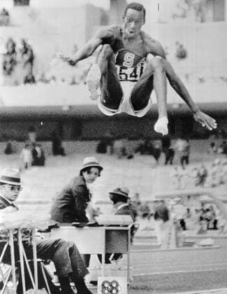 Bob Beamon el Paso Texas USA in a prodigiour leap which bettered the old world record by more than two feet leaps 29 feet 2 half inches at the mens long jump event to win Olympic Gold medal in the 19th Olympic Games 189 October Mexico City 1968  UnitedArchives01006492
