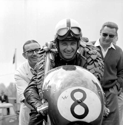 Brands Hatch, Kent: German Motor cycle racing ace, Ernst Degner has a smile of victory after he had ridden his Japanese Suzuki to triumph in the 50 C.C. event at Brands Hatch International Motor cycle Race. Went round the 2.65 mile grand prix circuit in 2 min. 16 seconds at an average speed of 70.14 miles per hour. 11 June 1962  UnitedArchives01015765