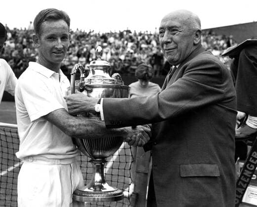 The final of the men s singles in the London grass court championships at Queen s Club , London. Rod Laver (Australia) beat his fellow coountryman Roy Emerson in the final .Mr T E Robinson , Senior Vice-President of the Australian Lawn Tennis Association presents the Men s Singles Trophy to Rod Laver. 23rd June 1962  UnitedArchives01178187