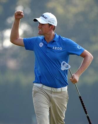 Webb Simpson reacts after sinking a long putt to save par on No. 17 during the first round of the PGA Golf Herren Tour Championship on September 19, 2013 at East Lake Golf Club in Atlanta. Simpson landed in a fairway bunker and had to take a penalty before carding a par on the hole.  AJP2013091914
