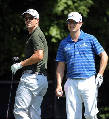 Adam Scott (L) and Zach Johnson hit from the No. 3 tee box during the first round of the PGA Golf Herren Tour Championship on September 19, 2013 at East Lake Golf Club in Atlanta. Scott finished the day at 5-under-par, one stroke off the lead.  AJP2013091917b