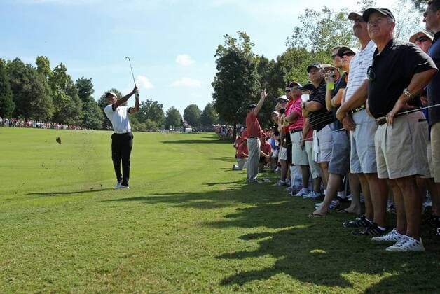Sept. 20, 2013 - Atlanta, Georgia, USA - With spectators nearby, Tiger Woods hits his second shot on the No. 1 fairway during round two of the 2013 Tour Championship at East Lake Golf Club in Atlanta, Georgia, Friday, September 20, 2013. Tour Championship - ZUMAm67