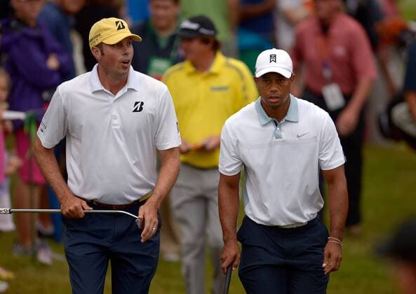Tiger Woods (R) and Matt Kuchar walk to hole 10 during the third round of the PGA Golf Herren Tour Championship on September 21, 2013 at East Lake Golf Club in Atlanta. Woods finished his round at 1 under par, a dozen strokes behind leader Henrik Stenson.  AJP2013092105