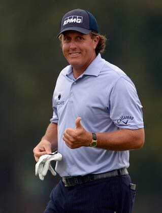 Phil Mickelson gives a thumbs-up to the gallery after putting out on hole six during the third round of the PGA Golf Herren Tour Championship on September 21, 2013 at East Lake Golf Club in Atlanta. Mickelson birdied the hole.  AJP2013092106