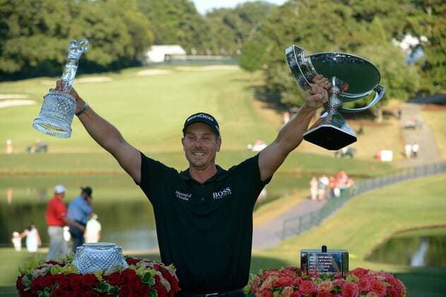 Tournament winner Henrik Stenson displays his winning trophy and silver cup after the final round of the PGA Golf Herren Tour Championship on September 22, 2013 at East Lake Golf Club in Atlanta. Henrik Stenson won the tournament over with a 13-under par and also brought home the FedEx Cup for a $10 million payout bonus.  AJP2013092233