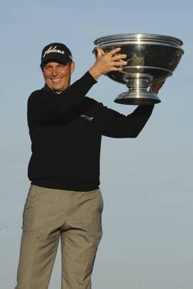 29.09.2013. St Andrews Scotland. The 4th and final Round of the Dunhill Golf Championship, from Old Course St Andrews. David Howell on Swilken Bridge with his winners trophy xLorrainexHillx  ActionPlus20522708