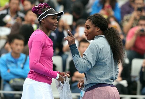 (130930) -- BEIJING, Sept. 30, 2013 (Xinhua) -- Serena Williams (R) talks to her sister Venus Williams before their women s doubles match at the China Open tennis tournament in Beijing, China, on Sept. 30, 2013. (Xinhua Meng Yongmin) (SP)CHINA-BEIJING-TENNIS-CHINA OPEN-WOMEN S DOUBLES (CN) 