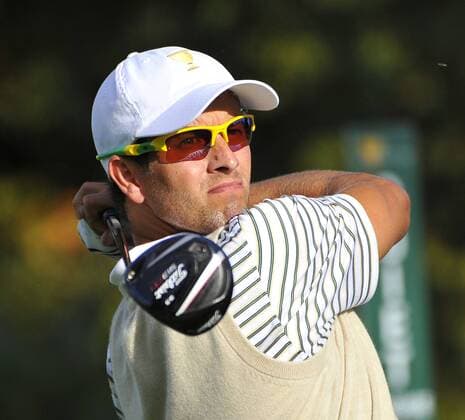 International Team member Adam Scott of Australia tees off on the 15th hole during the fourball matches against the United States at the 2013 Presidents Cup at Muirfield Village Golf Club in Dublin, Ohio on October 3, 2013. After Thursday s matches, the United States leads 3.5 to 2.5 points.  BKX2013100346