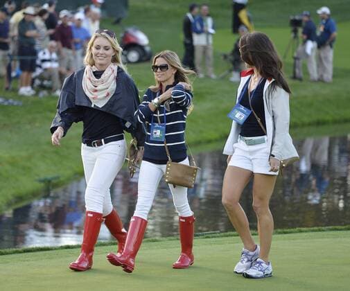 United States Team significant others Lindsey Vonn (L-R) Nadine Moze and Sybi Kuchar walk across the 14th green during the fourball matches against the International Team at the 2013 Presidents Cup at Muirfield Village Golf Club in Dublin, Ohio on October 3, 2013. After Thursday s matches, the United States leads 3.5 to 2.5 points.  BKX2013100368