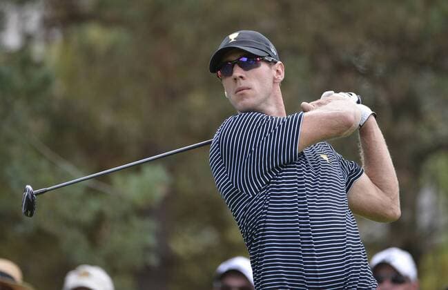 International Team member Graham DeLaet of Canada tees off on the second hole during the second round foursome competition against the United States Team at the 2013 Presidents Cup at Muirfield Village Golf Club in Dublin, Ohio on October 4, 2013.  BKX2013100413