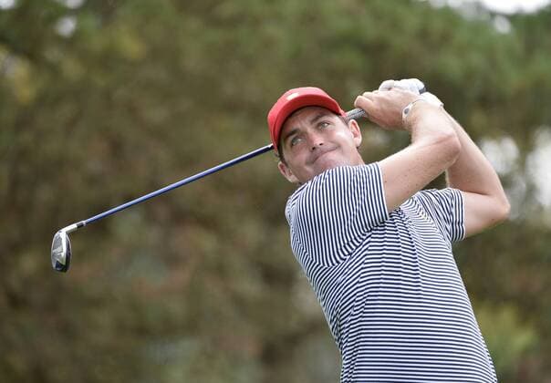 United States Team member Keegan Bradley tees off on the second hole during the second round foursome competition against the International Team at the 2013 Presidents Cup at Muirfield Village Golf Club in Dublin, Ohio on October 4, 2013.  BKX2013100414