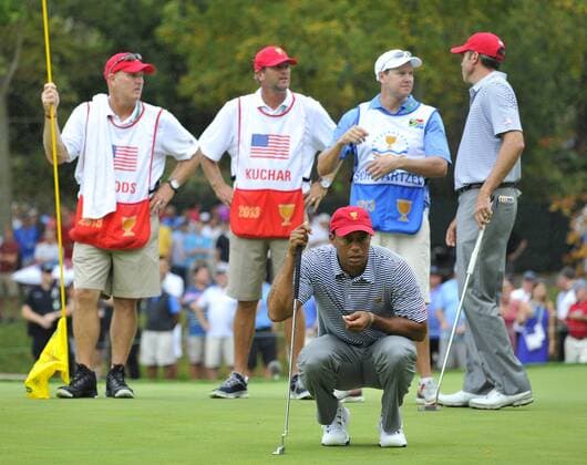 United States Team member Tiger Woods looks at his birdie putt on the sixth hole during the second round foursome competition against the International Team at the 2013 Presidents Cup at Muirfield Village Golf Club in Dublin, Ohio on October 4, 2013.  BKX2013100437