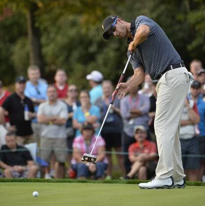 International Team member Adam Scott of Australia attempts a birdie putt on the ninth hole during the second round foursome competition against the United States Team at the 2013 Presidents Cup at Muirfield Village Golf Club in Dublin, Ohio on October 4, 2013. Scott missed the putt.  BKX2013100459