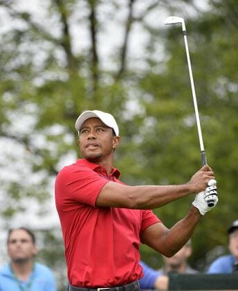 United States Team member Tiger Woods tees off on the 15th hole during the second round foursome competition against the International Team at the 2013 Presidents Cup at Muirfield Village Golf Club in Dublin, Ohio on October 5, 2013.  BKX2013100502
